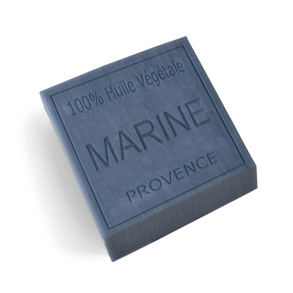 Unwrapped dark ocean blue soap bar with 'Marine Provence' branding inscribed on the bar, on a white background